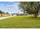 Ranch home with large yard and stone picnic table at 3400 Lake Padgett Dr, Land O Lakes, FL 34639