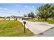 Ranch style home with large driveway and mature landscaping at 3400 Lake Padgett Dr, Land O Lakes, FL 34639