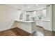 Modern kitchen with white shaker cabinets, quartz countertops, and island at 3400 Lake Padgett Dr, Land O Lakes, FL 34639