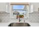 Sleek farmhouse sink with a modern faucet in a white kitchen at 3400 Lake Padgett Dr, Land O Lakes, FL 34639