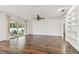 Bright living room with hardwood floors and sliding glass doors at 3400 Lake Padgett Dr, Land O Lakes, FL 34639