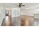 Living room with hardwood floors and built-in shelving at 3400 Lake Padgett Dr, Land O Lakes, FL 34639