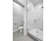 Modern bathroom with a glass shower and marble tile at 3421 W Horatio St # 109, Tampa, FL 33609