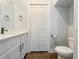 Clean bathroom with white vanity, toilet and built-in storage at 3421 W Horatio St # 109, Tampa, FL 33609