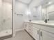 Elegant bathroom with double vanity and a large mirror at 3421 W Horatio St # 109, Tampa, FL 33609