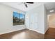 Bedroom with wood flooring, window, and ceiling fan at 3421 W Horatio St # 109, Tampa, FL 33609