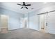 Spacious bedroom with carpet flooring and a sliding barn door at 3421 W Horatio St # 109, Tampa, FL 33609