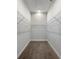 Walk-in closet with wire shelving and carpeted floor at 3421 W Horatio St # 109, Tampa, FL 33609