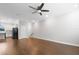 Bright living room with hardwood floors and a ceiling fan at 3421 W Horatio St # 109, Tampa, FL 33609