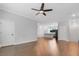 Open living room with hardwood floors and kitchen view at 3421 W Horatio St # 109, Tampa, FL 33609