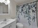 Bathroom with floral shower curtain and vanity at 3455 Countryside Blvd # 34, Clearwater, FL 33761