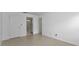 Bright bedroom with tile flooring and access to bathroom at 3455 Countryside Blvd # 34, Clearwater, FL 33761