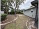 Large backyard with mature trees and garden space at 4108 W Oakellar Ave, Tampa, FL 33611