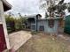 Backyard with multiple sheds and patio at 4108 W Oakellar Ave, Tampa, FL 33611