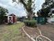 Spacious backyard with sheds and garden at 4108 W Oakellar Ave, Tampa, FL 33611