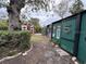 Backyard with sheds and landscaping at 4108 W Oakellar Ave, Tampa, FL 33611