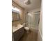 Modern bathroom with gray vanity and glass shower at 4108 W Oakellar Ave, Tampa, FL 33611