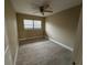 Bright bedroom with tile floors and ceiling fan at 4108 W Oakellar Ave, Tampa, FL 33611