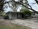 House exterior showcasing a front yard and driveway at 4108 W Oakellar Ave, Tampa, FL 33611