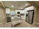 Modern kitchen with stainless steel appliances and an island at 4108 W Oakellar Ave, Tampa, FL 33611