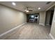 Spacious living room with wood-look tile floors and open concept at 4108 W Oakellar Ave, Tampa, FL 33611