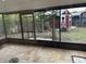 Screened porch overlooking backyard with shed at 4108 W Oakellar Ave, Tampa, FL 33611