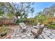 Landscaped backyard with stone patio and seating area at 4334 3Rd N Ave, St Petersburg, FL 33713