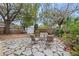 Relaxing backyard patio with seating area and mature trees at 4334 3Rd N Ave, St Petersburg, FL 33713