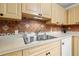 Double sink in kitchen with wood cabinets at 4334 3Rd N Ave, St Petersburg, FL 33713