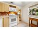 Kitchen with white appliances and wood cabinets at 4334 3Rd N Ave, St Petersburg, FL 33713