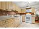 Updated kitchen with wood cabinets and appliances at 4334 3Rd N Ave, St Petersburg, FL 33713