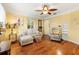 Bright living room with hardwood floors, comfy seating, and ceiling fan at 4334 3Rd N Ave, St Petersburg, FL 33713