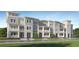 New townhouses with classic architecture, welcoming porches, and manicured landscaping at 4511 S Manhattan Ave # 19, Tampa, FL 33611