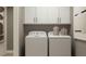 Laundry room with washer and dryer, and white cabinets at 4511 S Manhattan Ave # 19, Tampa, FL 33611