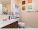 Small bathroom with toilet, sink, and shower at 4533 Ashburn Square Dr # 4533, Tampa, FL 33610