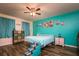 Bright bedroom with teal walls, a comfortable bed, and ample storage at 4533 Ashburn Square Dr # 4533, Tampa, FL 33610