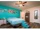 Serene bedroom featuring teal walls, pet stairs, and ample closet space at 4533 Ashburn Square Dr # 4533, Tampa, FL 33610