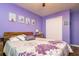 Lavender bedroom with floral bedding, and a large closet at 4533 Ashburn Square Dr # 4533, Tampa, FL 33610