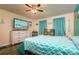 Bedroom with teal walls and patterned bedding, offering a tranquil atmosphere at 4533 Ashburn Square Dr # 4533, Tampa, FL 33610