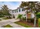 Tan townhome with attached garage and mature landscaping at 4533 Ashburn Square Dr # 4533, Tampa, FL 33610