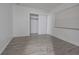 Bright bedroom with wood-look floors and a spacious closet at 4715 Christa Ct # 334, Tampa, FL 33614