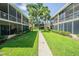 Pathway through a garden-like courtyard with two apartment buildings on either side at 4715 Christa Ct # 334, Tampa, FL 33614