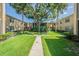 Landscaped courtyard with a central walkway and apartment buildings at 4715 Christa Ct # 334, Tampa, FL 33614