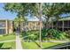 Courtyard area with lush landscaping and walkways between buildings at 4715 Christa Ct # 334, Tampa, FL 33614