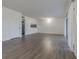 Spacious living room with wood-look floors and access to balcony at 4715 Christa Ct # 334, Tampa, FL 33614