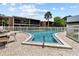 Community pool with patio furniture and a surrounding fence at 4715 Christa Ct # 334, Tampa, FL 33614