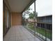 Spacious screened balcony with views of the community landscape at 4715 Christa Ct # 334, Tampa, FL 33614