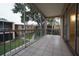 Private screened balcony overlooking a courtyard and lush greenery at 4715 Christa Ct # 334, Tampa, FL 33614