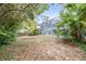 Large backyard with mature trees and a shed at 509 Oakhurst St, Brandon, FL 33511