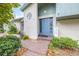 Inviting front entry with a blue door and brick pathway at 509 Oakhurst St, Brandon, FL 33511